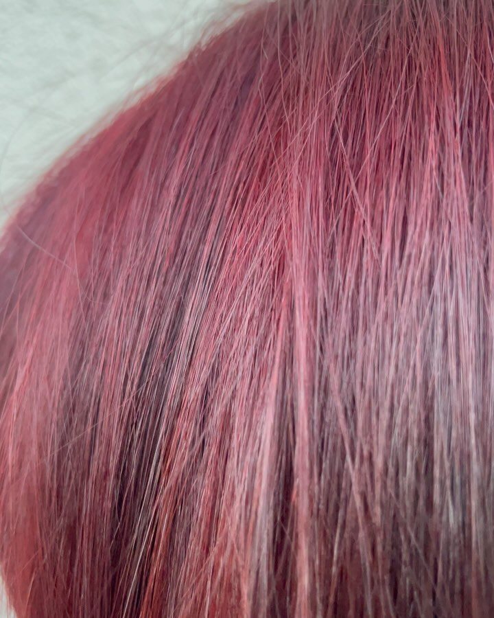 Vivid red pink hair color by Mirian May, hair colorist in Glendale, CA